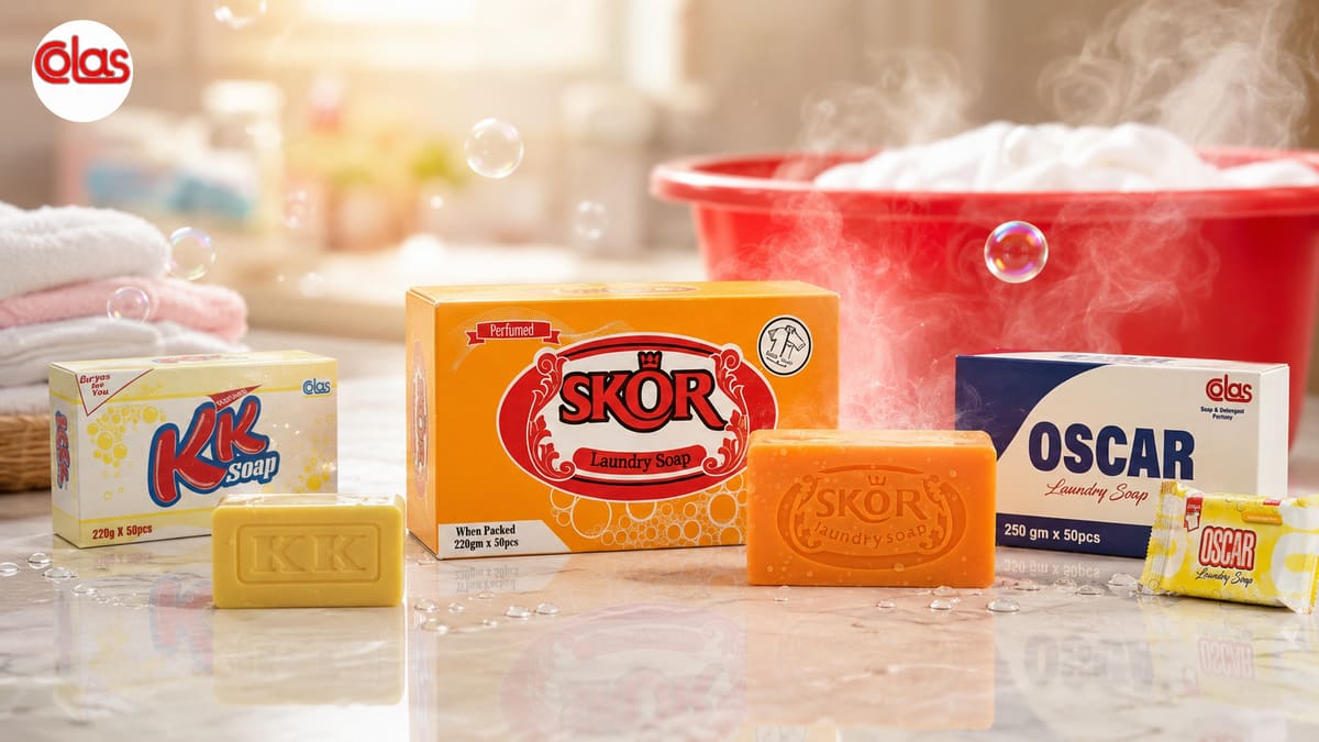 The Colas range on a marble worktop in warm morning light, beside a red basin of steaming laundry.