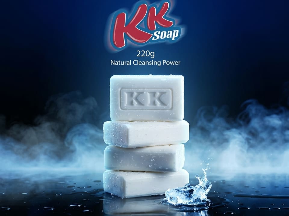 A stack of white KK soap bars in mist and water spray.