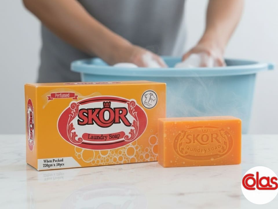 A SKOR Laundry Soap carton beside an embossed orange bar.